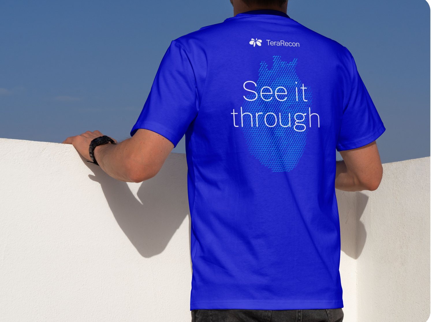 Apparel: a Cobalt T-shirt with the lockup, See it through and a heart particle flow